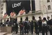  ?? Spencer Platt / Getty Images ?? The market debuts of Uber and competitor Lyft could mean fares will go up to please investors.