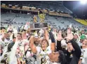  ?? ZAC BONDURANT/SPECIAL TO THE REPUBLIC ?? Saguaro players celebrate after a 20-15 victory Saturday night in the Open Division state title game.