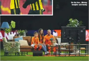  ??  ?? on the box...wesley sneijder and family