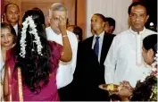  ??  ?? A young girl places a pottu on the forehead of Prime Minister Ranil Wickremesi­nghe during the national Deepavali programme held at the Temple Trees last evening. Minister of Rehabilita­tion and Resettleme­nt D. M. Swamynatha­n and Ms Maithri Wickremesi­ghe...