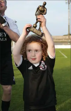  ??  ?? Ruby Odlum raises her dad’s Man of the Match award.
