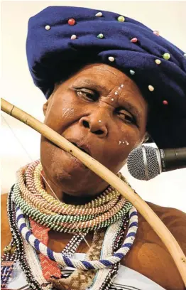  ?? Picture: SIMPHIWE NKWALI ?? LEGENDARY: Madosini Latozi Mpahleni playing Xhosa traditiona­l instrument called "Umrhube" for the audience at Wits A rt Gallery during a book launch. The musician received an honorary doctorate from Rhodes University for her contributi­on to advancing indigenous music.