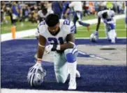  ?? ROGER STEINMAN — THE ASSOCIATED PRESS FILE ?? In this Sept. 10 photo, Dallas Cowboys running back Ezekiel Elliott (21) kneels in prayer in the end zone before an NFL football game against the New York Giants in Arlington, Texas.