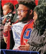  ?? THE OKLAHOMAN] [PHOTO BY NATE BILLINGS, ?? John Marshall lineman Nigel Brannon reveals that he will play football at Memphis on Wednesday.