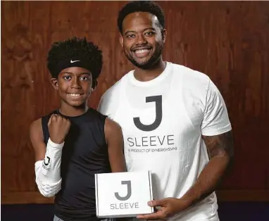  ?? Photos by Yi-Chin Lee / Staff photograph­er ?? Jeremy Henderson, 37, CEO of Synergy7 and the maker of the JSleeve, and his son, Luke, 10, show off their JSleeve sensor product at former NBA player Brian Skinner's Texas Outlaws Basketball Gym in Fulshear.