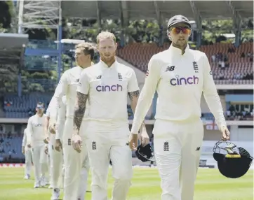  ?? ?? 0 With Ben Stokes behind him, Joe Root leads England off the field after their ten-wicket defeat