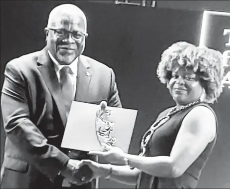  ?? ?? Dr Estherine Adams receiving the Guyana Prize for Literature Non Fiction Award from Prime Minister Mark Phillips