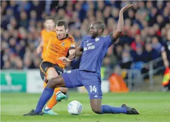  ??  ?? Wolverhamp­ton Wanderers’ Leo Bonatini in action with Cardiff City’s Sol Bamba. — Reuters