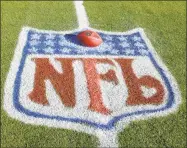  ?? Getty Images ?? The official football for the National Football League sits within the NFL logo painted on the field at Fedex Field in Landover, Maryland.