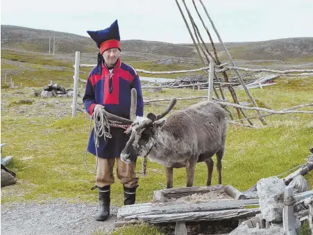  ??  ?? MUST-SEES: A Sami man and his reindeer, above. The Sami are Scandinavi­a’s only indigenous people, with their own language and culture. Stave churches, such as Fantoft Stave Church, right, near Bergen once abounded.