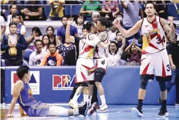  ??  ?? TNT KaTropa’s Don Trollano looks in agony as San Miguel Beer’s Terrence Romeo, Chris Ross, and Christian Standhardi­nger celebrate their Game 5 victory. Photo below has TNT’s RR Pogoy placing SMB’s Arwind Santos in an arm-lock. (Rio Deluvio)