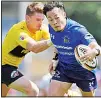  ??  ?? Japan winger Kenki Fukuoka, (right), of Panasonic Wild Knights runs past Suntory Sungoliath’s Beauden Barrett of New Zealand on way to a successful try during the final of Japan’s Top League club competitio­n in Tokyo, on May 23. (AP)