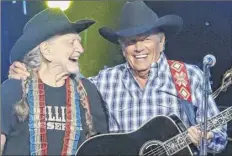  ?? Al Wagner / Invision / Associated Press ?? Willie Nelson, left, and George Strait perform at “Willie: Life &amp; Songs of an American Outlaw” on Saturday at Bridgeston­e Arena in Nashville, Tenn.