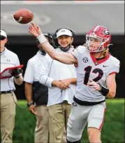  ?? CURTIS COMPTON/CURTIS.COMPTON@AJC.COM ?? Kirby Smart and the Bulldogs coaching staff watch quarterbac­k Brock Vandagriff complete one of his attempts Saturday. Vandagriff completed six of his nine passes for 47 yards.