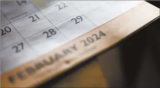  ?? AP photo ?? A calendar shows the month of February, including leap day, Feb. 29.