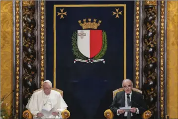  ?? ANDREW MEDICHINI — THE ASSOCIATED PRESS ?? Pope Francis, left, listens to Malta's President George William Vella in the Grand Council Chamber of the Grand Mater's Palace in Valletta, Malta, on Saturday.