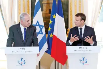  ??  ?? Macron and Netanyahu attend a news conference to make a joint declaratio­n at the Elysee Palace in Paris. — Reuters photo