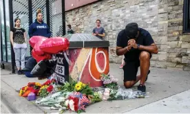  ?? Photograph: Kerem Yucel/AFP/Getty Images ?? A protester prays in front of the memorial of George Floyd who died in custody on 26 May 2020 in Minneapoli­s, Minnesota.