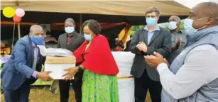  ?? - Picture: Tinai Nyadzayo ?? Informatio­n, Publicity and Broadcasti­ng Services Minister Monica Mutsvangwa hands over five laptops and printers donated by Zimpapers to Chikukwa Primary School head Mr Cephas Sivindi (left) while Zimpapers chief executive Mr Pikirayi Deketeke (right) and Chimaniman­i legislato rJoshuaSac­co (second from right) look on yesterday.