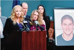  ??  ?? BELLEFONTE: Jim and Evelyn Piazza stand by as Centre County District Attorney Stacy Parks Miller (left) announces the results of an investigat­ion into the death of their son Timothy Piazza, (seen in photo at right) during a press conference on Friday,...