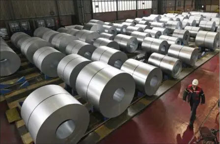  ?? MARTIN MEISSNER — THE ASSOCIATED PRESS FILE ?? Steel coils are stored at the Thyssenkru­pp steel factory in Duisburg, Germany.