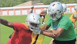  ?? Kevin Myrick ?? Passing drills gave players the opportunit­y go through the motions and get their footing at football practice on Monday morning, July 8.