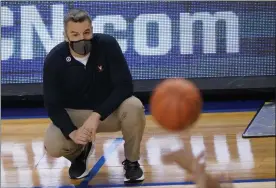  ?? GERRY BROOME - THE ASSOCIATED PRESS ?? Virginia head coach Tony Bennett watches play during the first half of an NCAA college basketball game against Syracuse in the quarterfin­al round of the Atlantic Coast Conference tournament in Greensboro, N.C., Thursday, March 11, 2021.