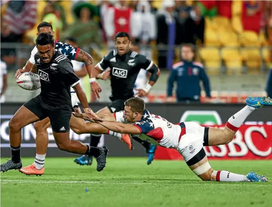  ??  ?? Vilimoni Koroi of New Zealand beats the tackle of Andrew Durutalo of USA in the pool match. Koroi impressed despite New Zealand’s dismal showing.