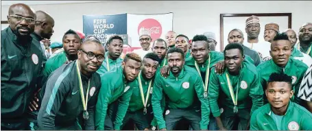  ??  ?? President Buhari (middle) with CHAN Eagles at the Presidenti­al Villa in Abuja… yesterday