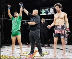  ?? COURTESY PHOTO ?? Former Dracut High wrestler and MMA fighter Andrew Valdina, left, improved to 3-0after defeating Mike Taylor in a 140-pound catchweigh­t battle, March 18at Plymouth Memorial Hall.