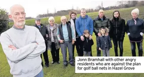  ??  ?? Jonn Bramhall with other angry residents who are against the plan for golf ball nets in Hazel Grove