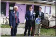  ?? MID-HUDSON NEWS NETWORK ?? State Sen. James Skoufis, center, talks about the new law on Monday in front of a condemned house in the city of Newburgh, N.Y. Looking on are state Assemblyme­n Jonathan Jacobson, left, and Kenneth Zebrowski.