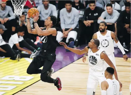  ?? THE ASSOCIATED PRESS ?? The Toronto Raptors’ DeMar DeRozan of Team Stephen goes hard to the basket past three Team LeBron defenders during Sunday’s NBA All-Star Game at Staples Center in Los Angeles. Despite 21 points by DeRozan, Team LeBron hung on to win the game by a score...