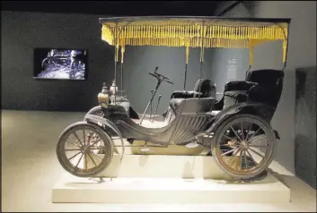  ?? Chris Carlson The Associated Press ?? A 1901 Duryea Surrey in the exhibition “Empress Dowager, Cixi” at Orange County’s Bowers Museum. The exhibit focuses on Cixi, the mysterious woman who ruled China with an iron fist from the mid-1800s until her death in 1908.