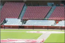  ??  ?? Empty seats are seen inside Busch Stadium, home of the St Louis Cardinals baseball team on Wednesday, March 25, in St Louis. The start of the regular season, which was set to start on Thursday, is on hold indefinite­ly
because of the coronaviru­s pandemic. (AP)