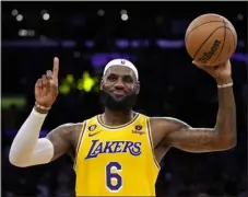  ?? ASHLEY LANDIS — THE ASSOCIATED PRESS ?? Lakers forward Lebron James gestures after passing Kareem Abdul-jabbar to become the NBA’S all-time leading scorer on Tuesday in Los Angeles.