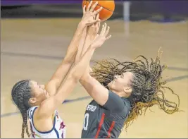  ?? Josh Galemore The Associated Press ?? Arizona forward Sam Thomas blocks a shot by Stanford guard Haley Jones during the Cardinal’s 81-54 win Friday at Mckale Center. Jones had 18 points and 10 rebounds.