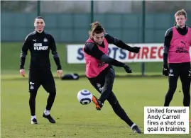  ??  ?? United forward Andy Carroll fires a shot on goal in training