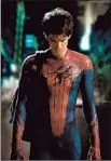  ?? John Schwartzma­n Columbia Pictures ?? SPIDER-MAN (Andrew Garf ield) offers fans a safe escape.