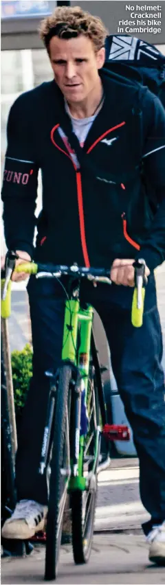  ??  ?? No helmet: Cracknell rides his bike in Cambridge