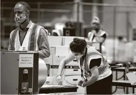  ?? Krison Jae Bethel / New York Times ?? Workers process ballots in Philadelph­ia under bright lights and observatio­n by both parties, not a “shroud of darkness” alleged by Texas Sen. Ted Cruz.