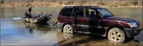  ?? (Arkansas Democrat-Gazette/Bryan Hendricks) ?? Chris Larson trailers his boat at a gravel bar on the Ouachita River.