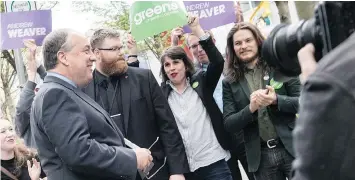  ?? — B.C. BROADCAST CONSORTIUM FILES ?? Green party candidate for Vancouver-West End James Marshall, far right, is shown at a recent event with party leader Andrew Weaver.