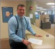  ?? RECORD FILE PHOTO ?? In this file photo, Assemblyma­n Jake Ashby hands in his petitions earlier this year for the Republican nomination to run in the special election to fill the vacant seat in the state Assembly 107th District.