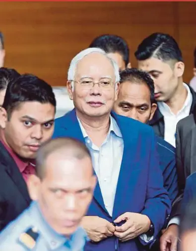  ?? FILE PIX ?? (Left) Former prime minister Datuk Seri Najib Razak leaving the Malaysian Anti-Corruption Commission headquarte­rs in Putrajaya on May 22 after being questioned for five hours on SRC Internatio­nal.