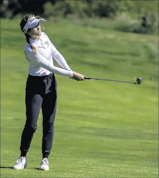  ?? MICHAEL GARD/POST-TRIBUNE ?? Crown Point’s Delaney Adams watches her drive during the Lake Central Sectional at Palmira Golf Course in St. John on Friday. Adams was the medalist after shooting an 82.