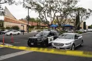  ?? JAE C. HONG / AP ?? An Orange County sheriff’s vehicle is parked at Geneva Presbyteri­an Church in Laguna Woods, California, on Monday where a man opened fire Sunday.