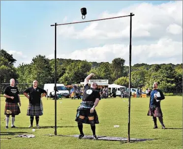  ?? CAMERON HEWITT/RICK STEVES’ EUROPE ?? Many Scottish Highland Games events feature competitor­s hurling heavy weights, such as tossing a 56-pound weight over a bar using one hand.