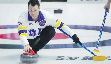  ?? ARRYL DYCK, THE CANADIAN PRESS ?? British Columbia skip Catlin Schneider of Victoria delivers a rock while playing Team Manitoba-Carruthers during the Brier, in Regina, on Tuesday. B.C. won 9-8, but later fell to Northern Ontario.