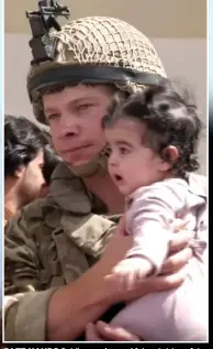  ??  ?? SAFE HANDS Soldier carries an Afghan tot to safety